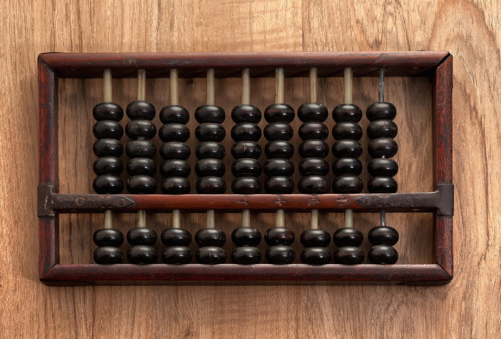Old abacus on wooden table